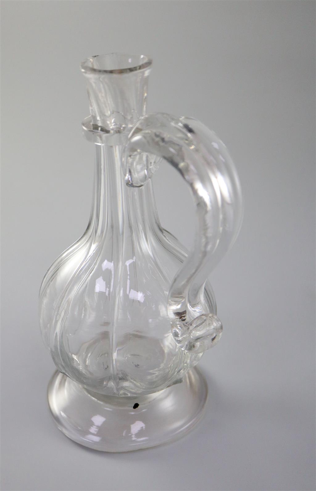 A Georgian rib moulded glass cordial jug, first half 18th century, 20.5cm high